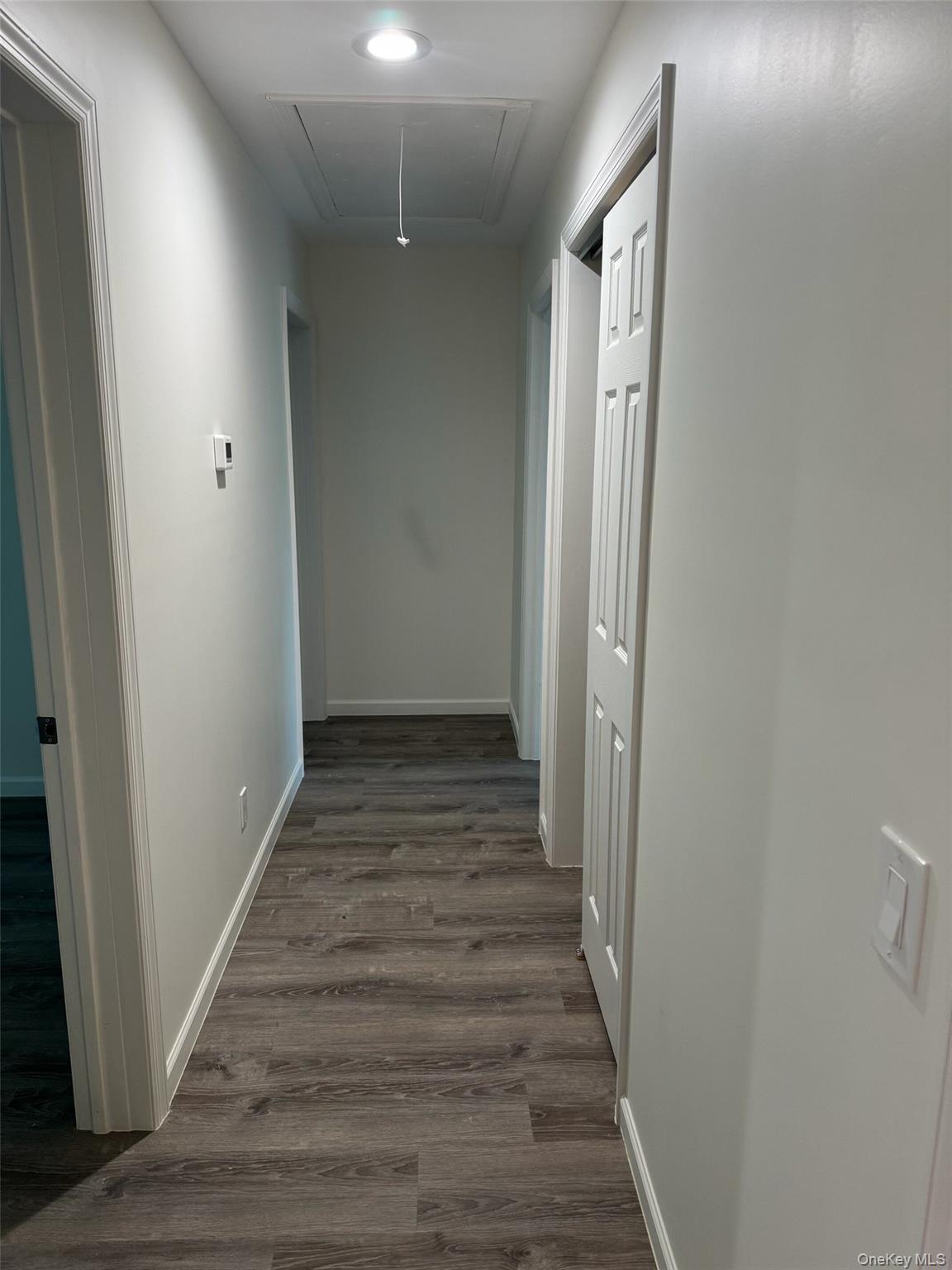 11 East Alexandra Matthews Wallkill, NY 12589 - Photo 4 of 9 Corridor and dark wood-style floors