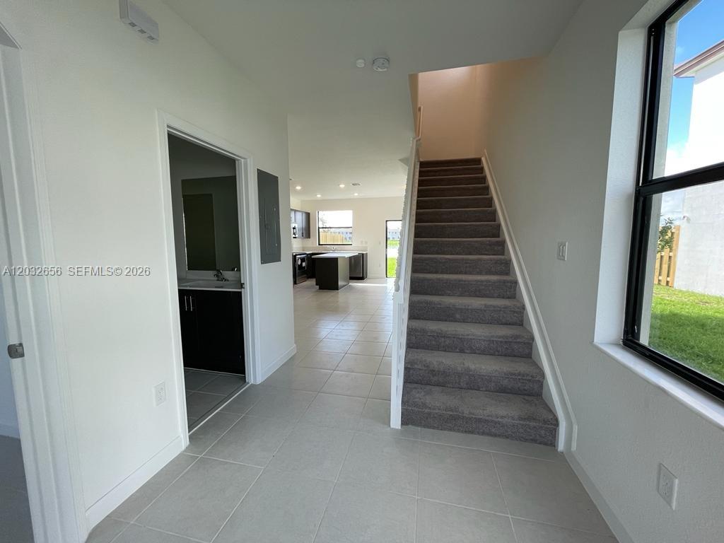 10144 Southwest 228th Terrace Miami, FL 33190 - Photo 5 of 23 a view of a hallway view with staircase