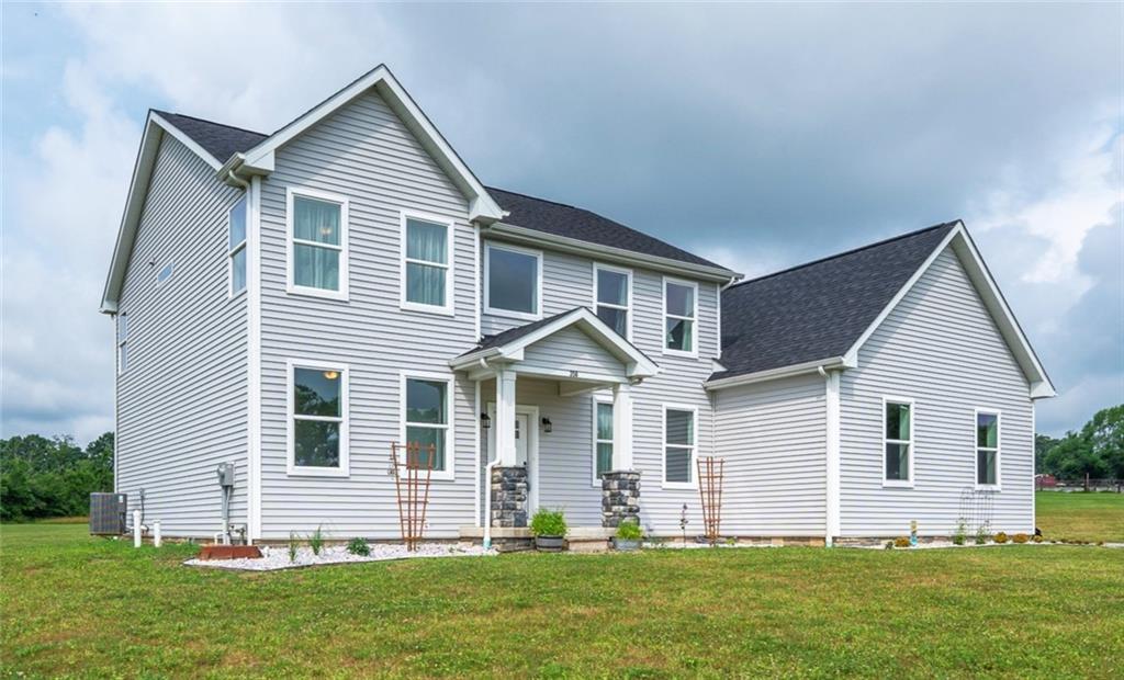 a front view of a house with a yard