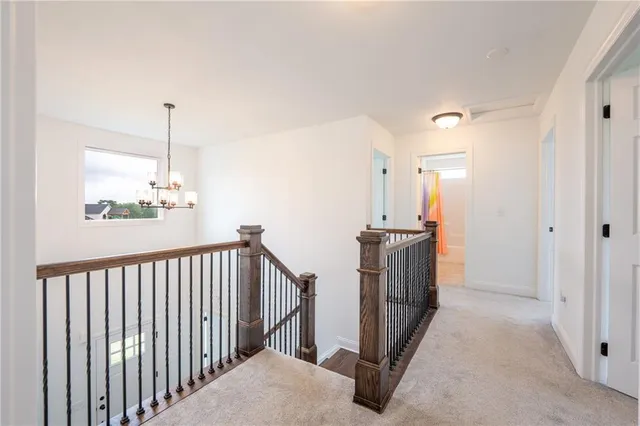 a view of a hallway with windows