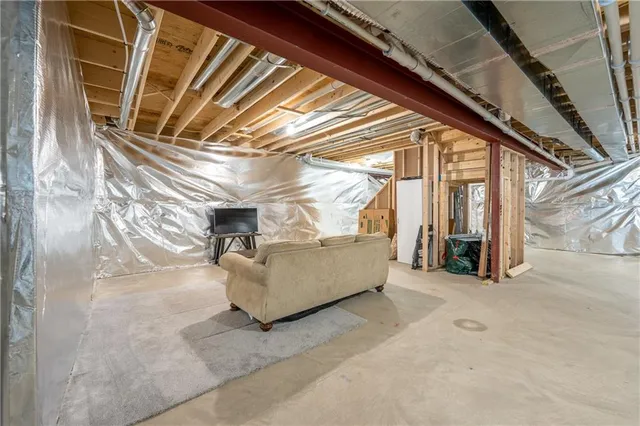 a backyard of a house with barbeque oven and table