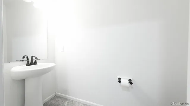 a bathroom with a sink a mirror and vanity