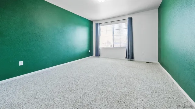 a view of a room with a large window