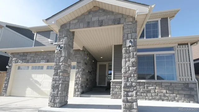 a front view of a house with a white door