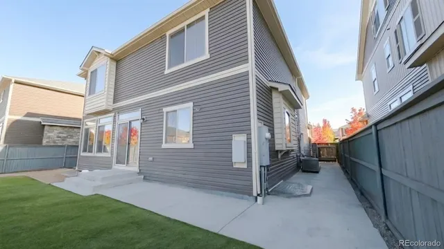 a view of a porch with furniture and a fireplace