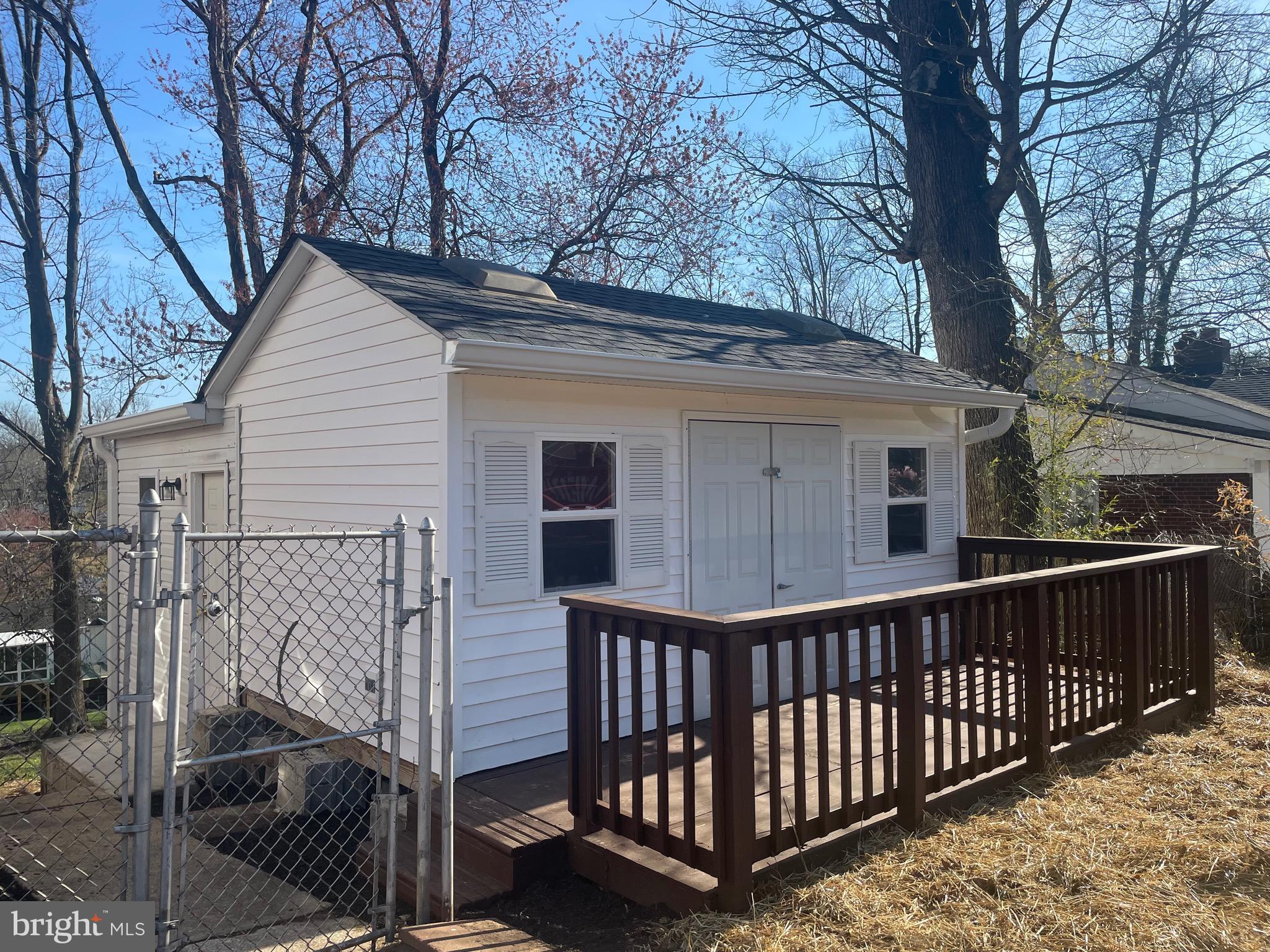 6107 Buckler Road Clinton, MD 20735 - Photo 2 of 45 a view of a house with a wooden fence