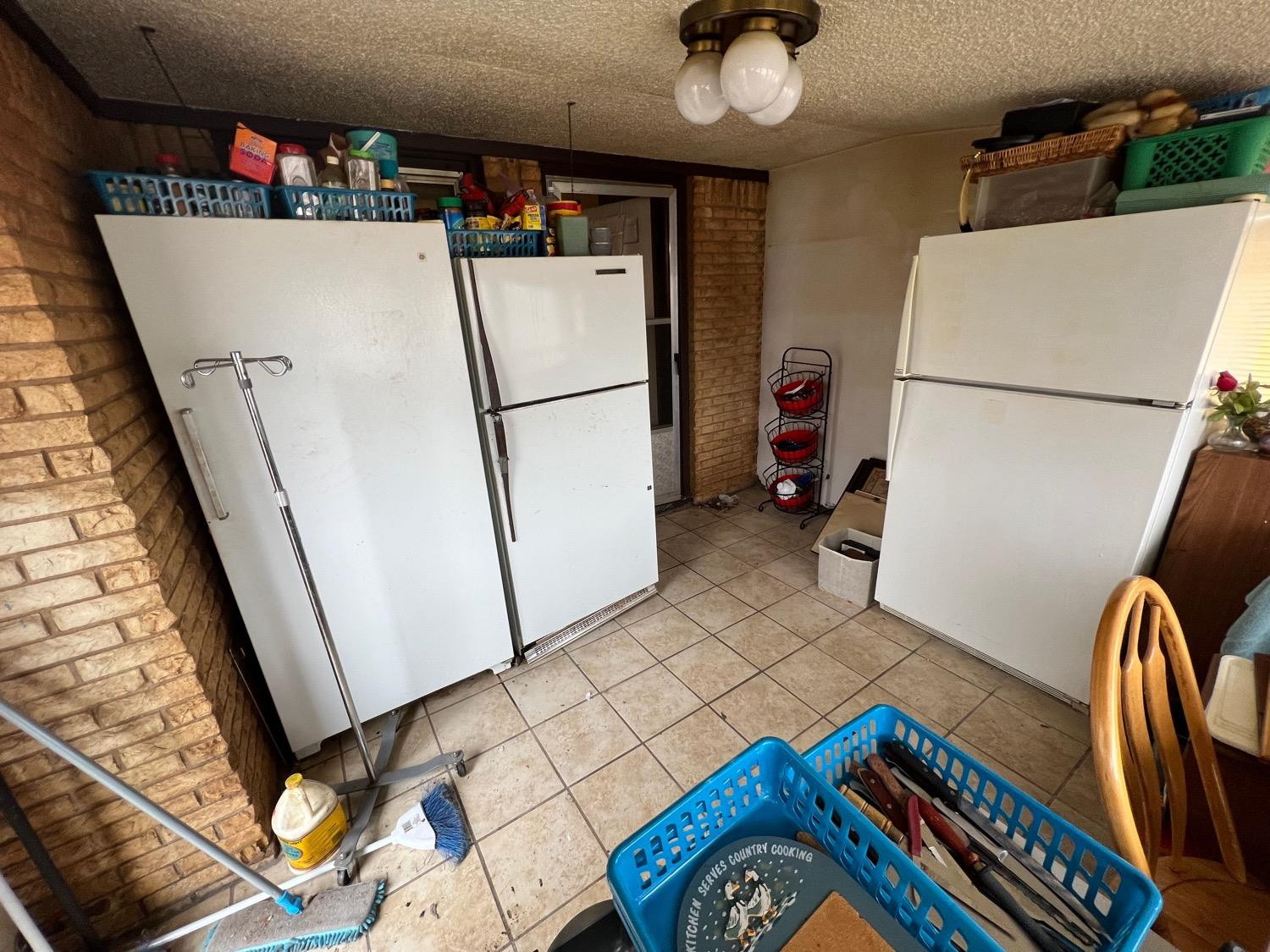 4812 46th Street Lubbock, TX 79414 - Photo 7 of 9 a view of storage and utility room with washer and dryer