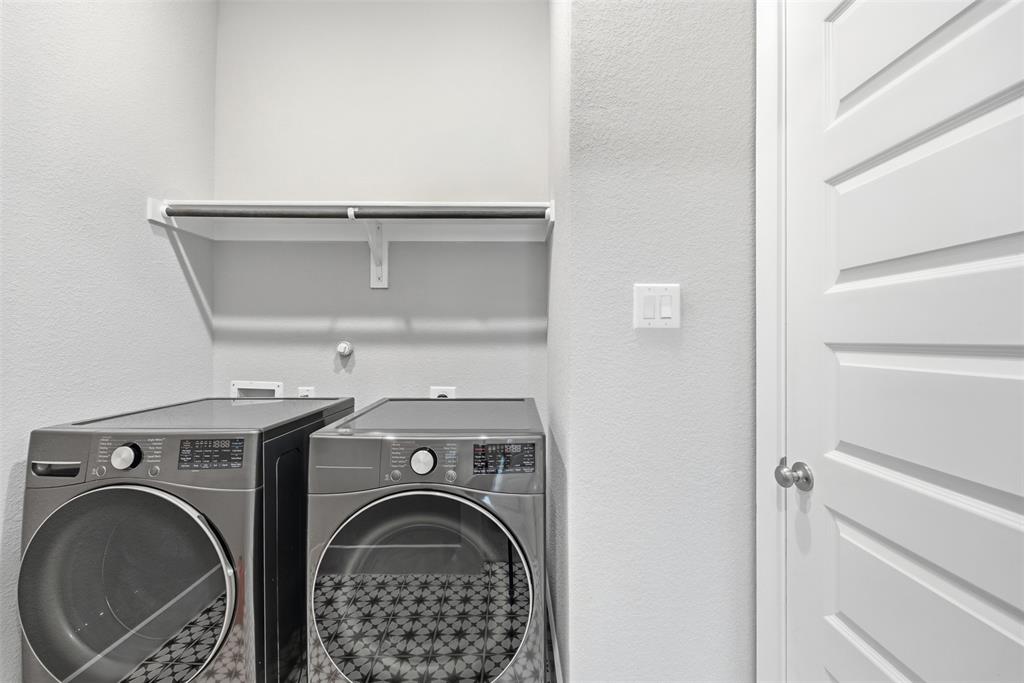 5805 Heatherwood Loop Sachse, TX 75048 - Photo 18 of 39 a utility room with dryer and washer
