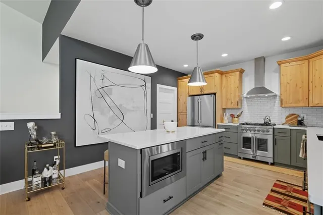 a kitchen with a stove window and cabinets