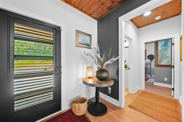 a living room with a sink and a potted plant