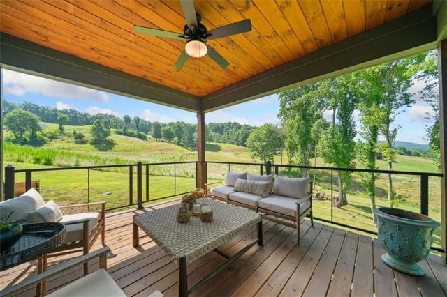 a view of deck with furniture and outside view