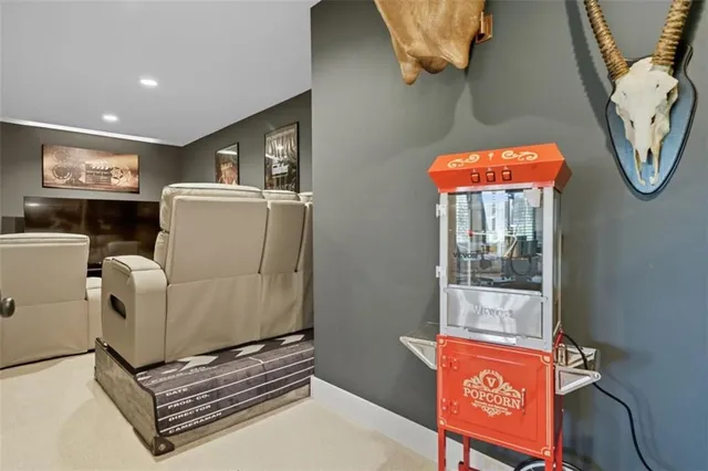 a living room with furniture a window and a flat screen tv