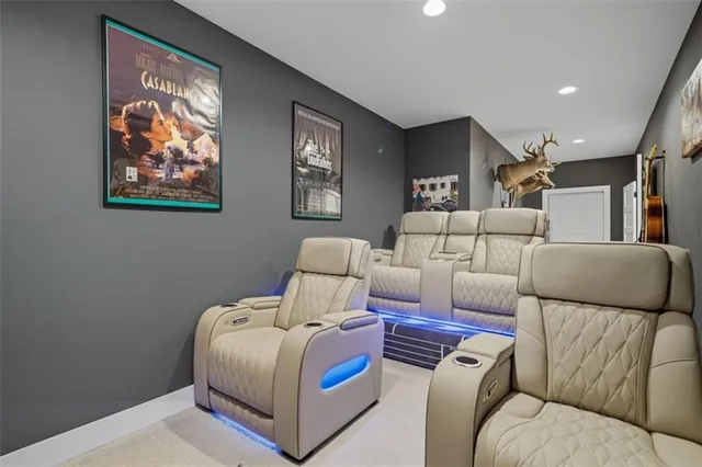 a living room with furniture and wall painting