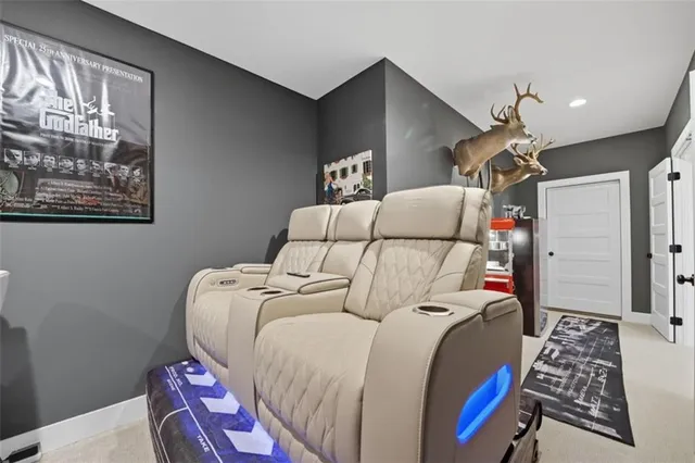 a bedroom with bed and a painting