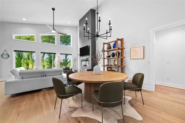 a view of a dining room with furniture window and wooden floor