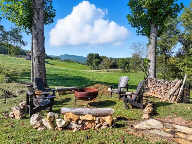 a view of a house with backyard porch and sitting area