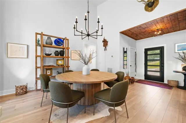 a view of a room with furniture and wooden floor