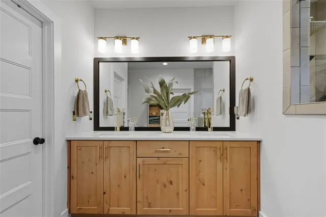 a bathroom with a sink and a mirror