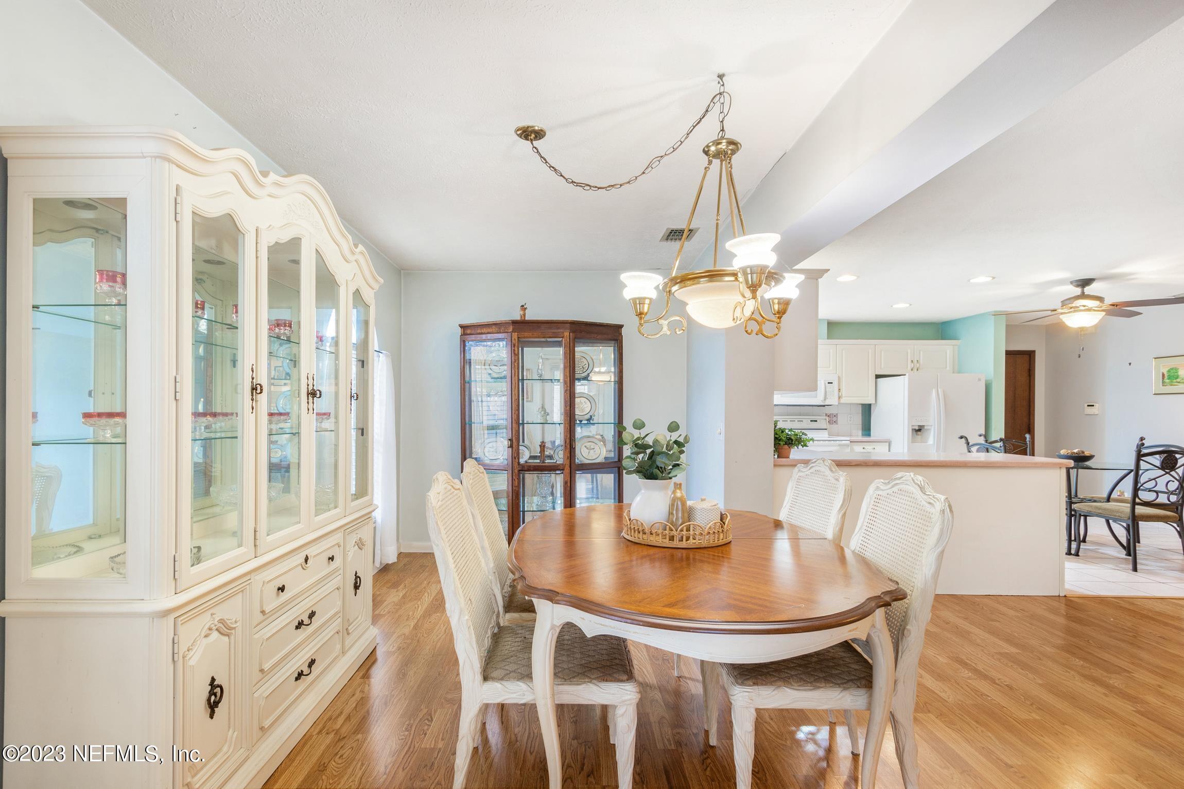 1131 Prince Road St. Augustine, FL 32086 - Photo 12 of 29 a view of a dining room with furniture and chandelier