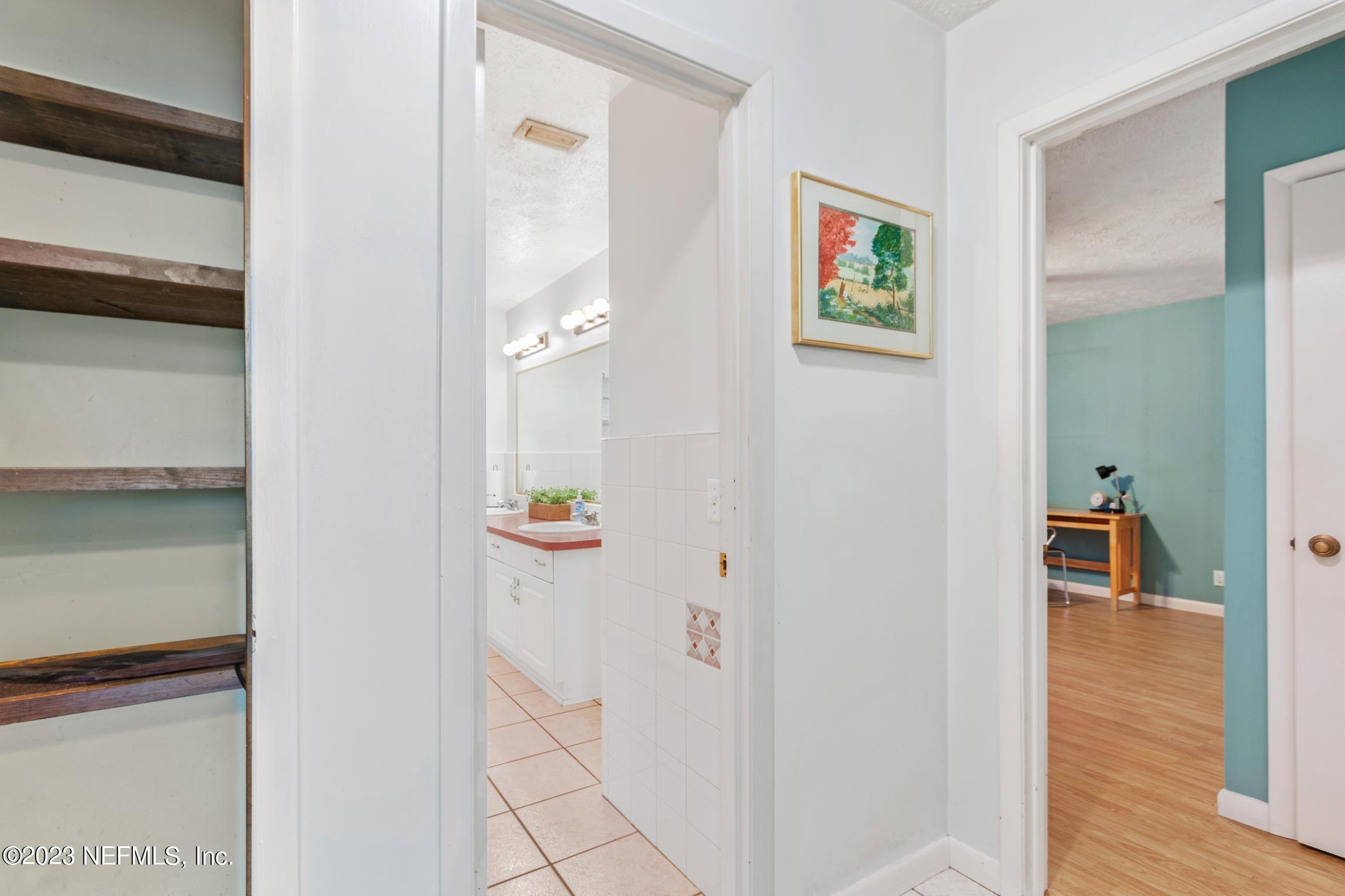 1131 Prince Road St. Augustine, FL 32086 - Photo 14 of 29 a view of a hallway with paintings on the wall