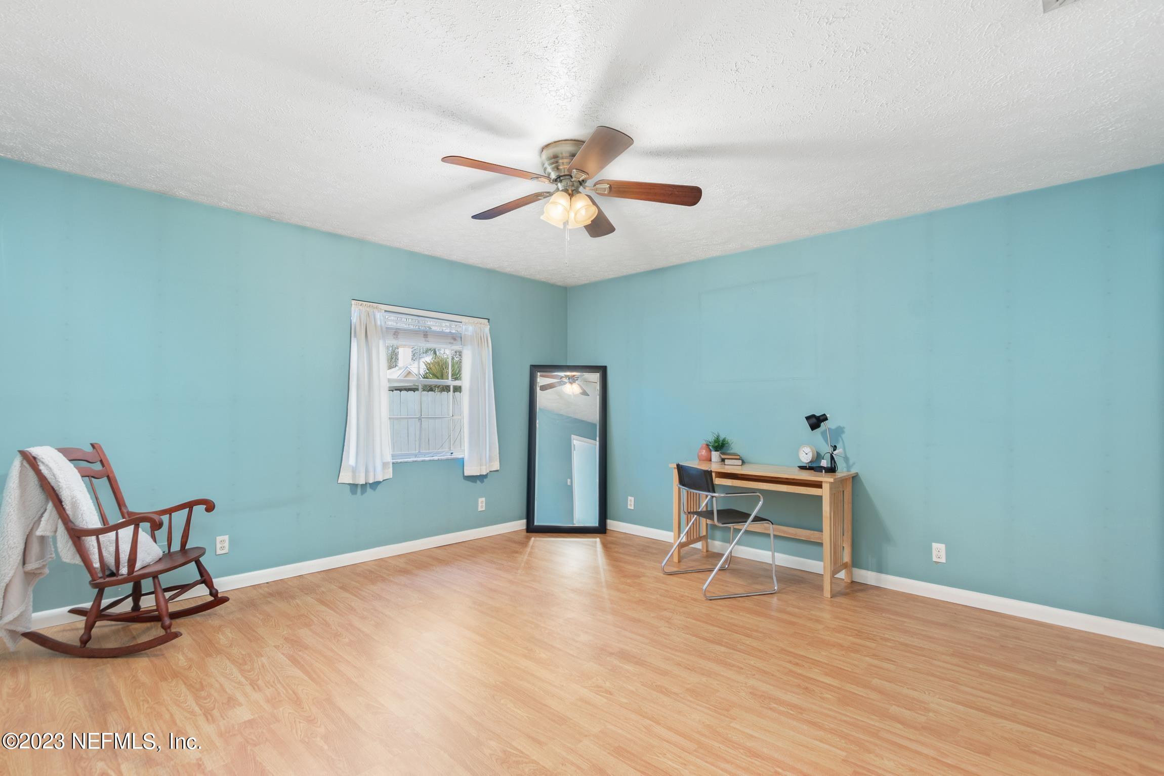1131 Prince Road St. Augustine, FL 32086 - Photo 17 of 29 a bedroom with furniture and a ceiling fan