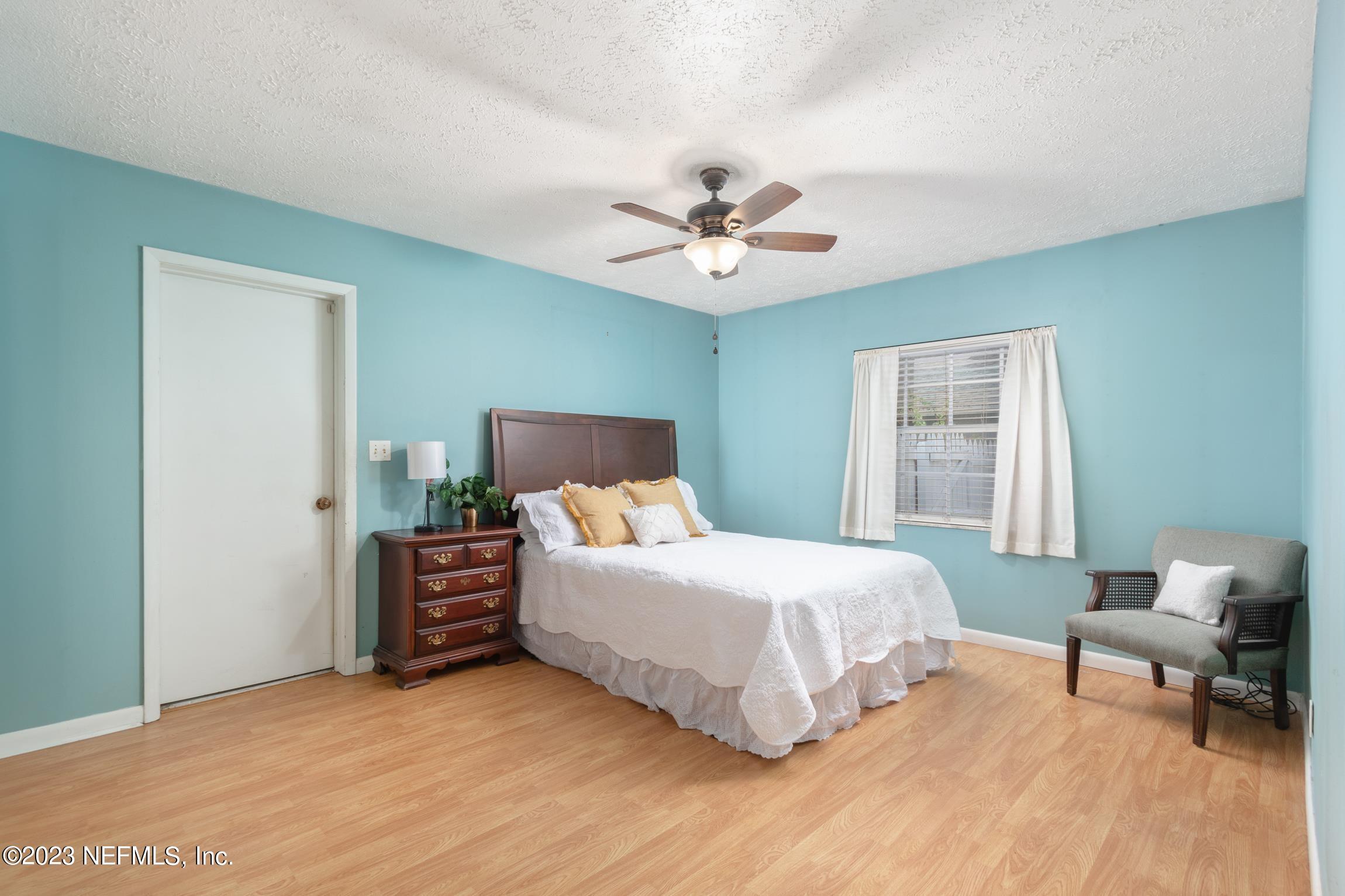 1131 Prince Road St. Augustine, FL 32086 - Photo 20 of 29 a bedroom with a bed and a chair