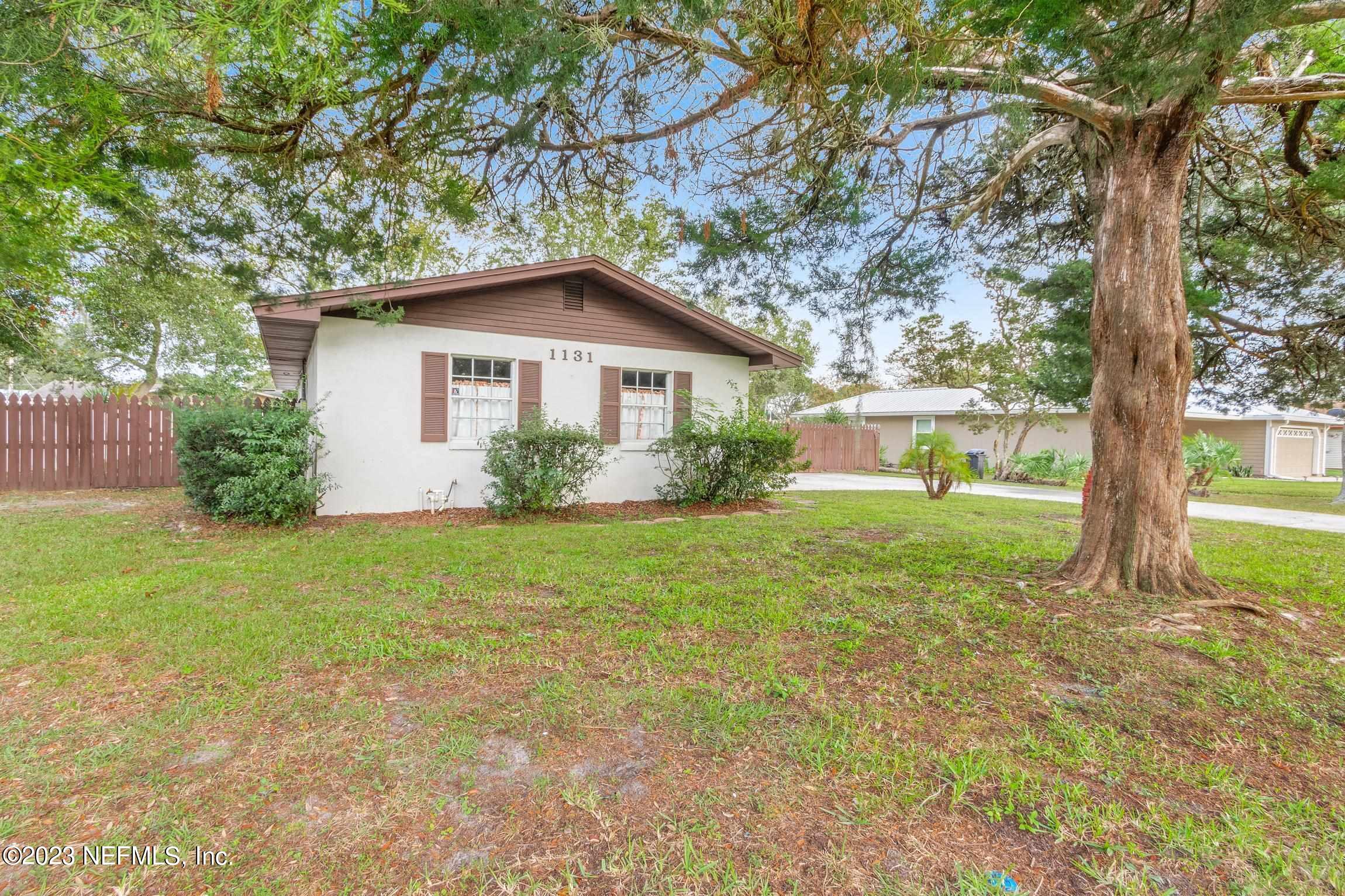 1131 Prince Road St. Augustine, FL 32086 - Photo 26 of 29 a view of a house with yard and a tree