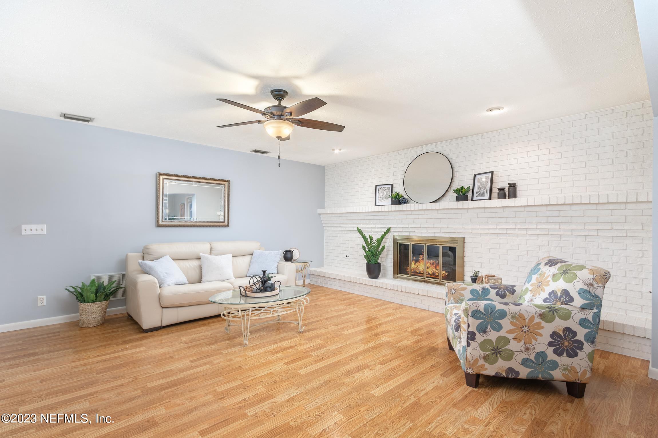 1131 Prince Road St. Augustine, FL 32086 - Photo 10 of 29 a living room with furniture and a fireplace