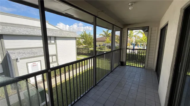 a view of a porch with a floor to ceiling window