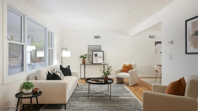 a living room with furniture and a rug