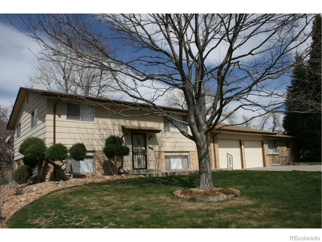 a view of a yard in front view of a house