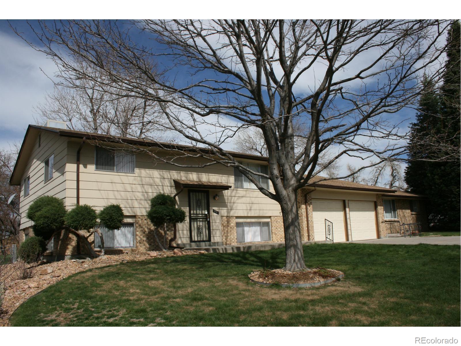 1273 Moore Street, Unit 1273 Denver, CO 80215 - Photo 1 of 13 a view of a yard in front view of a house