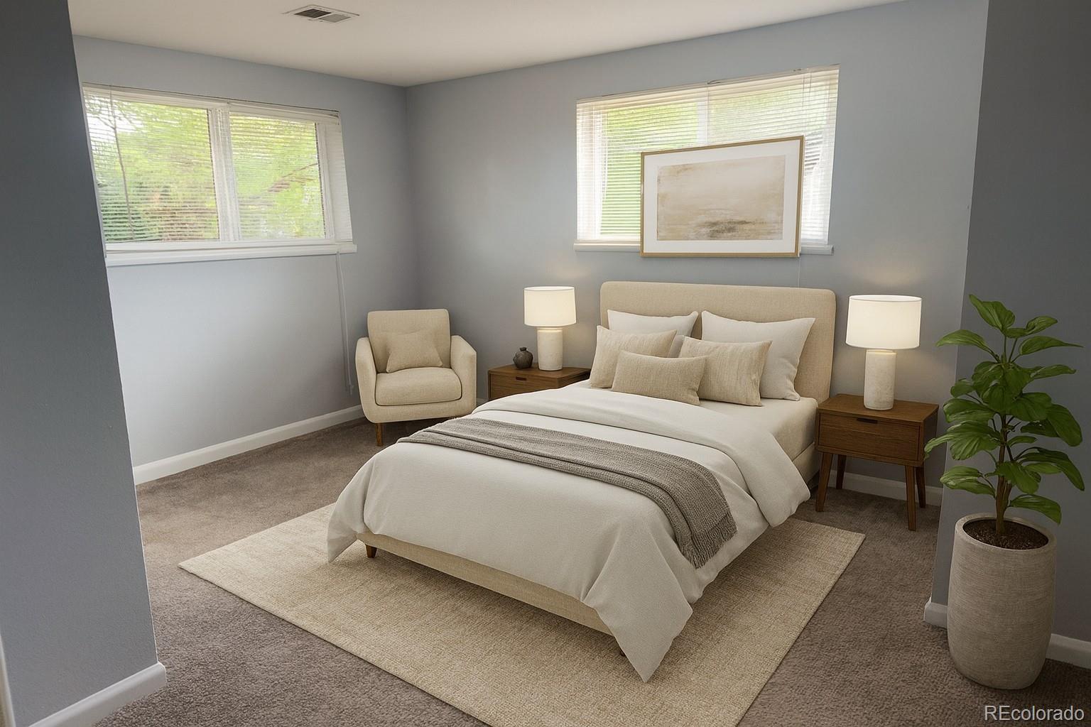 1273 Moore Street, Unit 1273 Denver, CO 80215 - Photo 4 of 13 a bedroom with bed and a potted plant