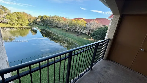 a view of a lake from a balcony
