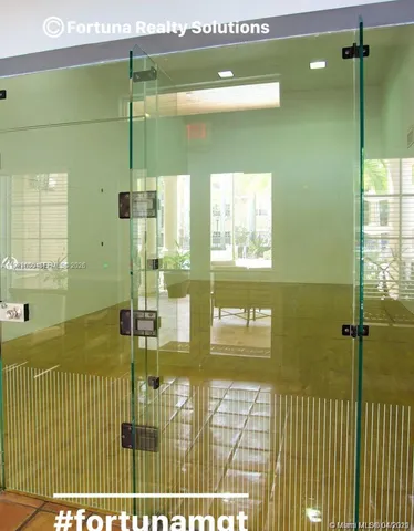a bathroom with a glass shower door