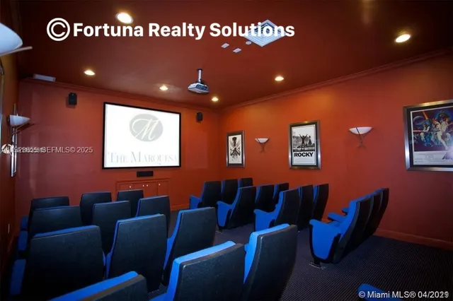 a media room with lots of chairs and a projector