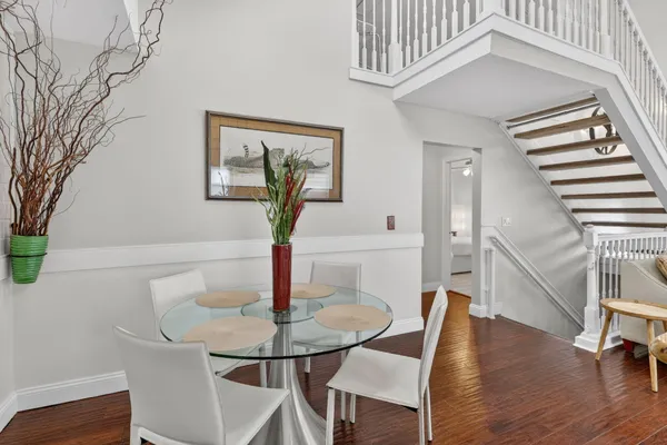 a view of a dining room with furniture and wooden floor