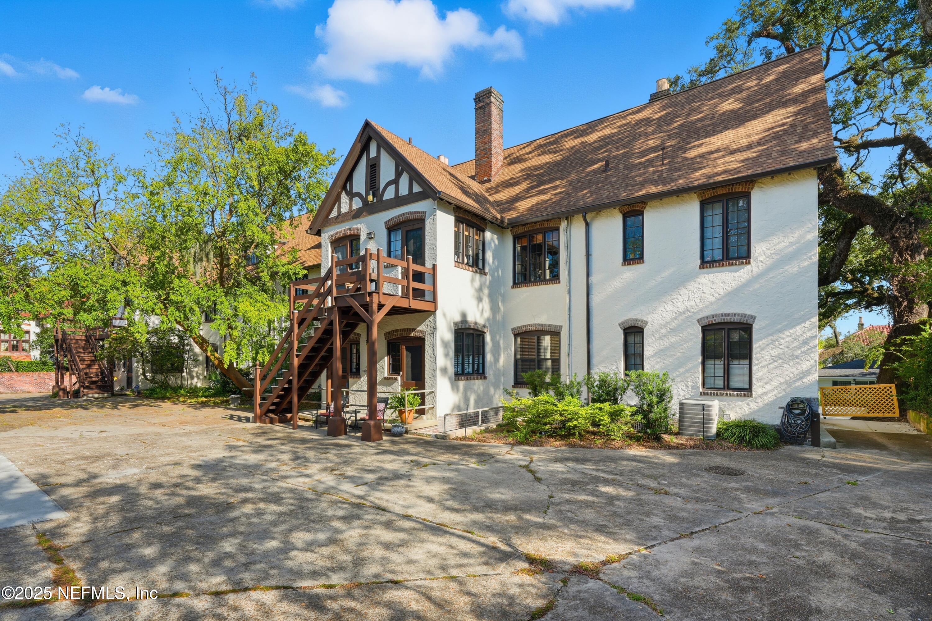3319 Pine Street, Unit 2 Jacksonville, FL 32205 - Photo 19 of 31 a front view of a house with a yard