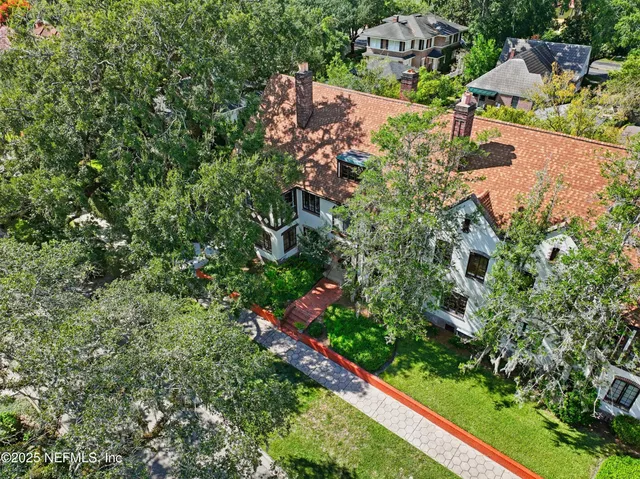 an aerial view of a house with a garden