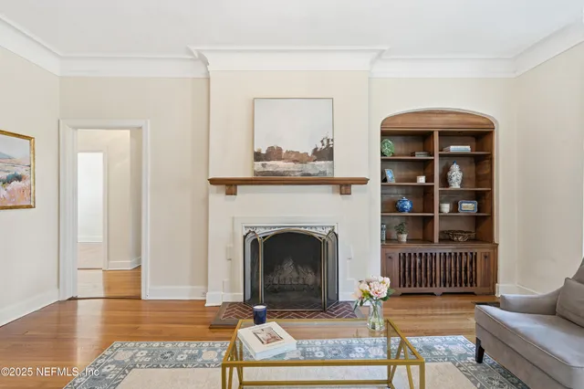 a living room with furniture and a fireplace