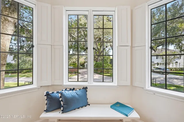 a living room with furniture and window