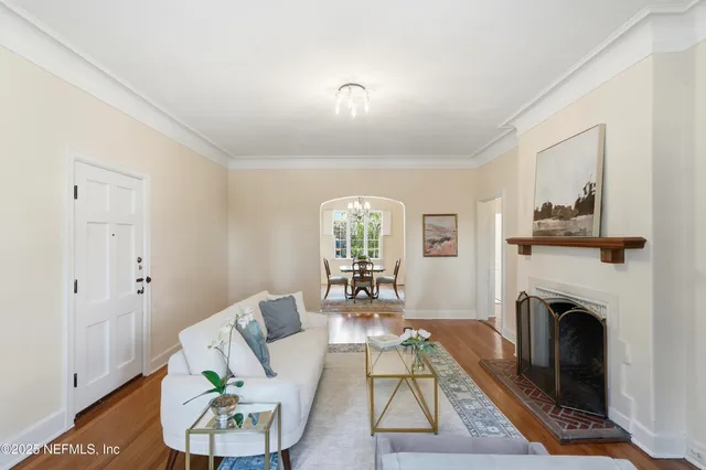 a living room with furniture and a fireplace