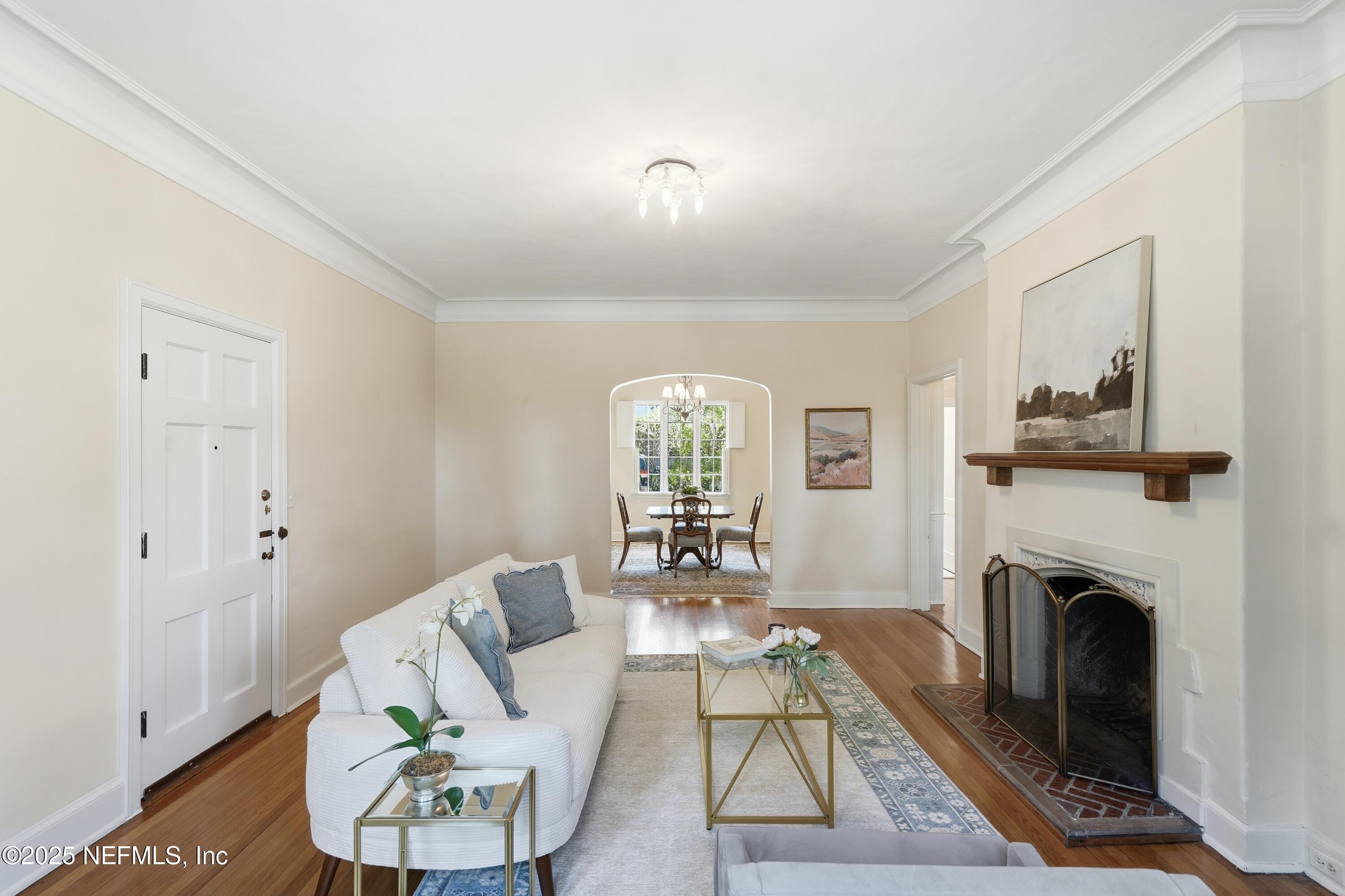 3319 Pine Street, Unit 2 Jacksonville, FL 32205 - Photo 7 of 31 a living room with furniture and a fireplace