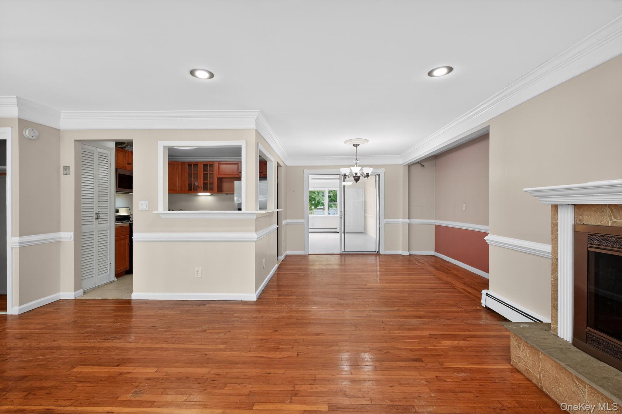 138 Spring Street Massapequa, NY 11758 - Photo 8 of 45 a view of a living room with furniture and a fireplace