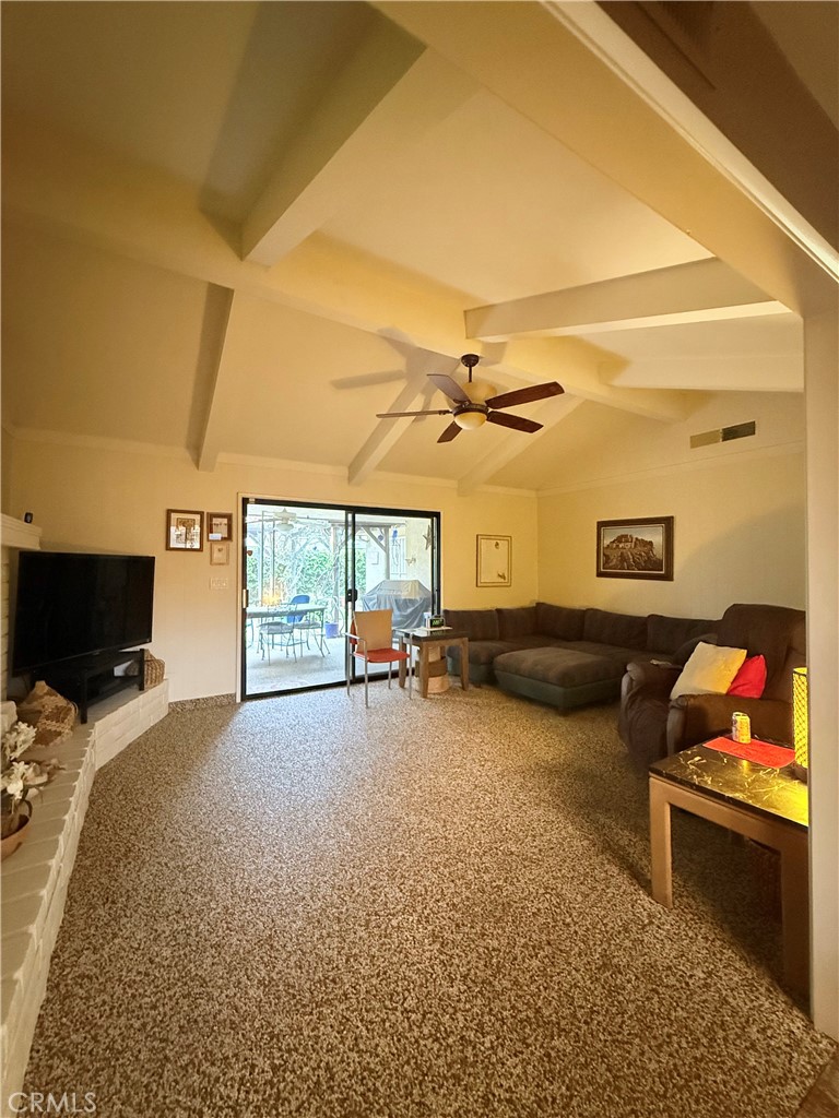 6380 North 5th Street Fresno, CA 93710 - Photo 17 of 31 a bedroom with furniture and a flat screen tv