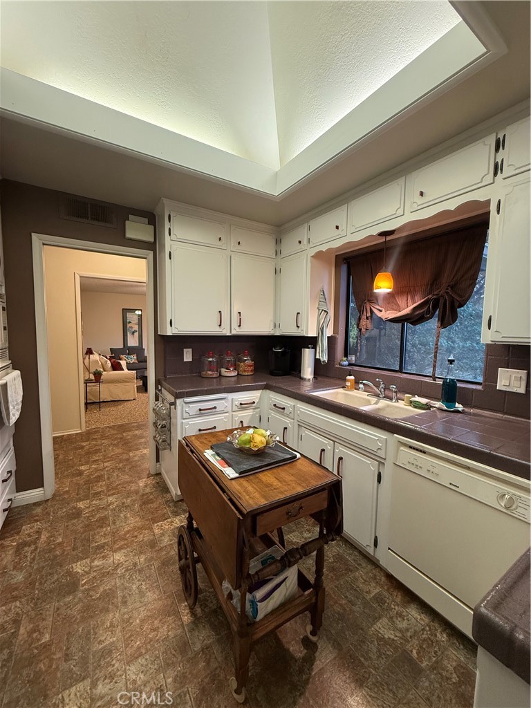 6380 North 5th Street Fresno, CA 93710 - Photo 18 of 31 a kitchen with a stove and cabinets