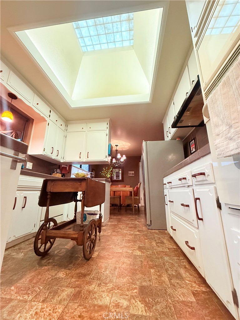 6380 North 5th Street Fresno, CA 93710 - Photo 19 of 31 a view of a kitchen with furniture and window