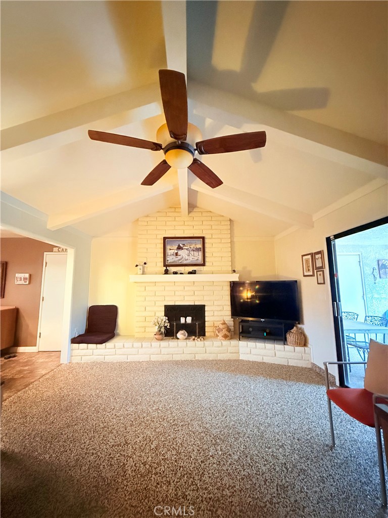 6380 North 5th Street Fresno, CA 93710 - Photo 23 of 31 a living room with furniture and a fireplace