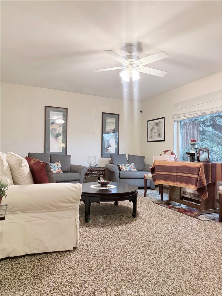 6380 North 5th Street Fresno, CA 93710 - Photo 26 of 31 a living room with furniture and a rug