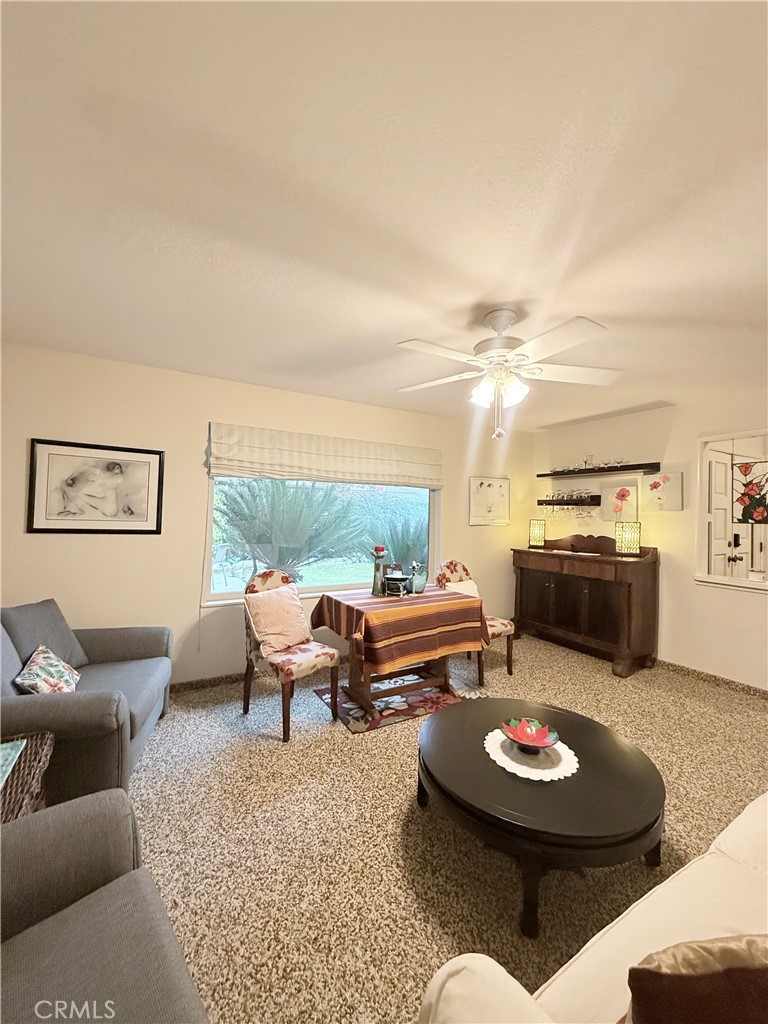 6380 North 5th Street Fresno, CA 93710 - Photo 27 of 31 a living room with furniture and a couch
